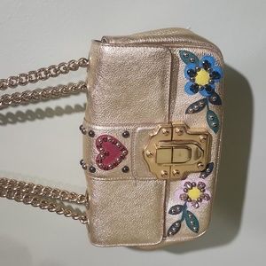 Cute dolce and gabbana purse.  Shiny gold with jewels.